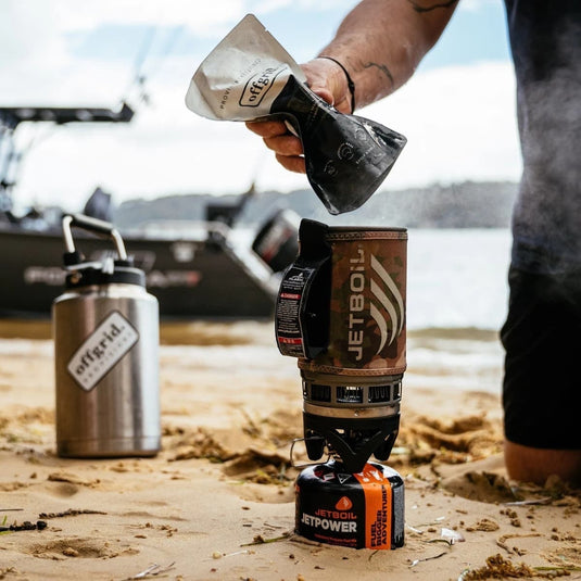 Cadetshop Offgrid Performance Series cherry acai breakfast bowl pouch being prepared on a portable camping stove
