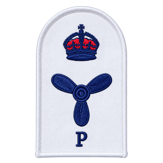 White embroidered naval rank insignia patch featuring a blue crown with red detailing above a blue propeller, and the letter ’p’ below