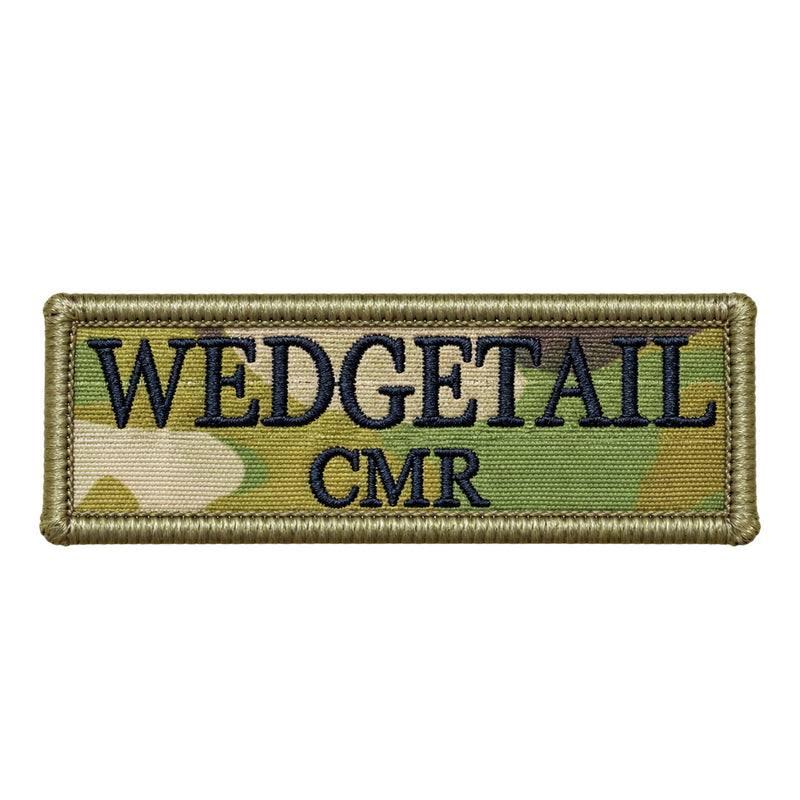 Load image into Gallery viewer, A rectangular embroidered patch with a camouflage pattern in shades of green and tan, featuring the word ’wedgetail’ in bold black lettering above ’cmr,’ bordered by a stitched olive-green edge
