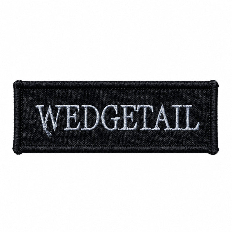 Load image into Gallery viewer, Black rectangular patch with embroidered silver ’wedgetail’ text
