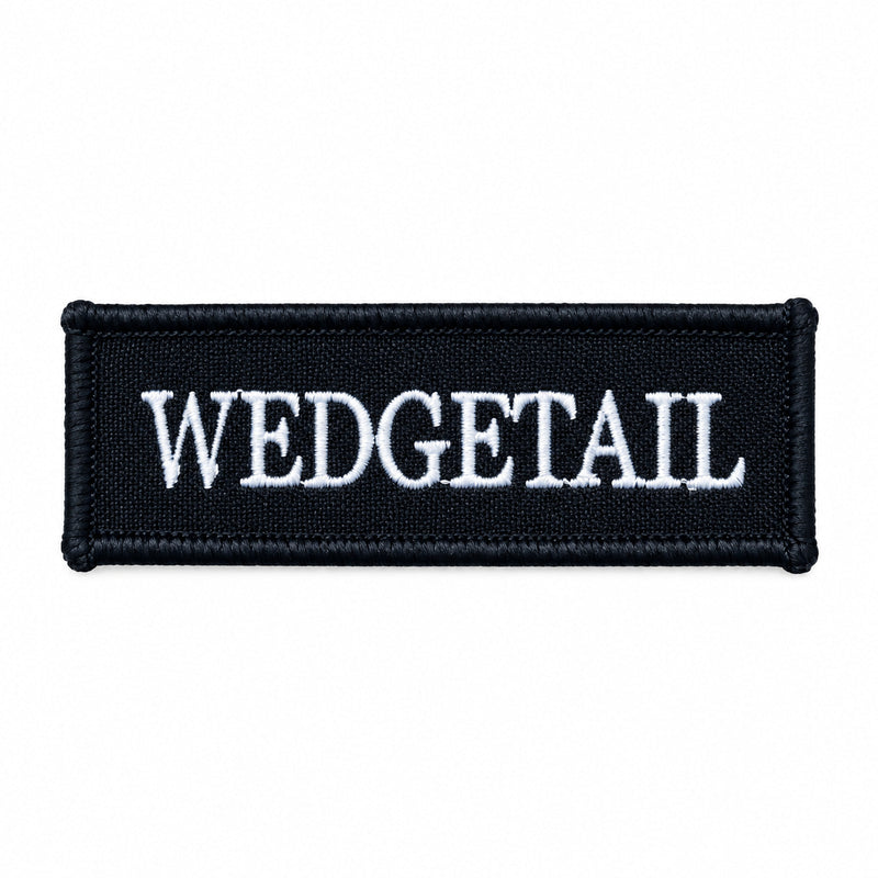 Load image into Gallery viewer, Black rectangular patch with white embroidered ’wedgetail’ text

