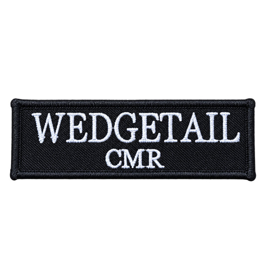 Black embroidered patch with white stitched text reading ’wedgetail’ above ’cmr’